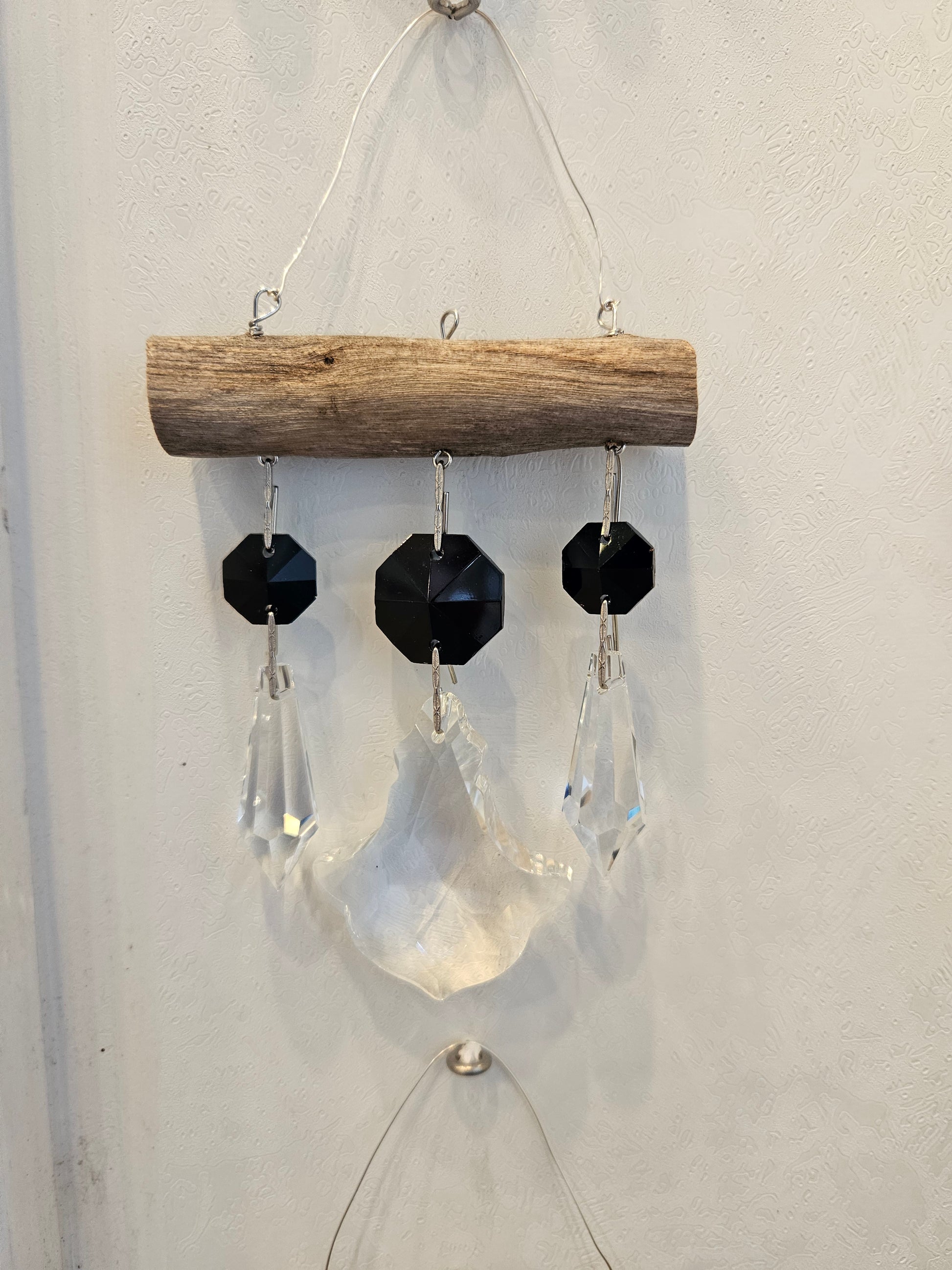 Black and clear chandelier crystal suncatcher by Dazzling Driftwood